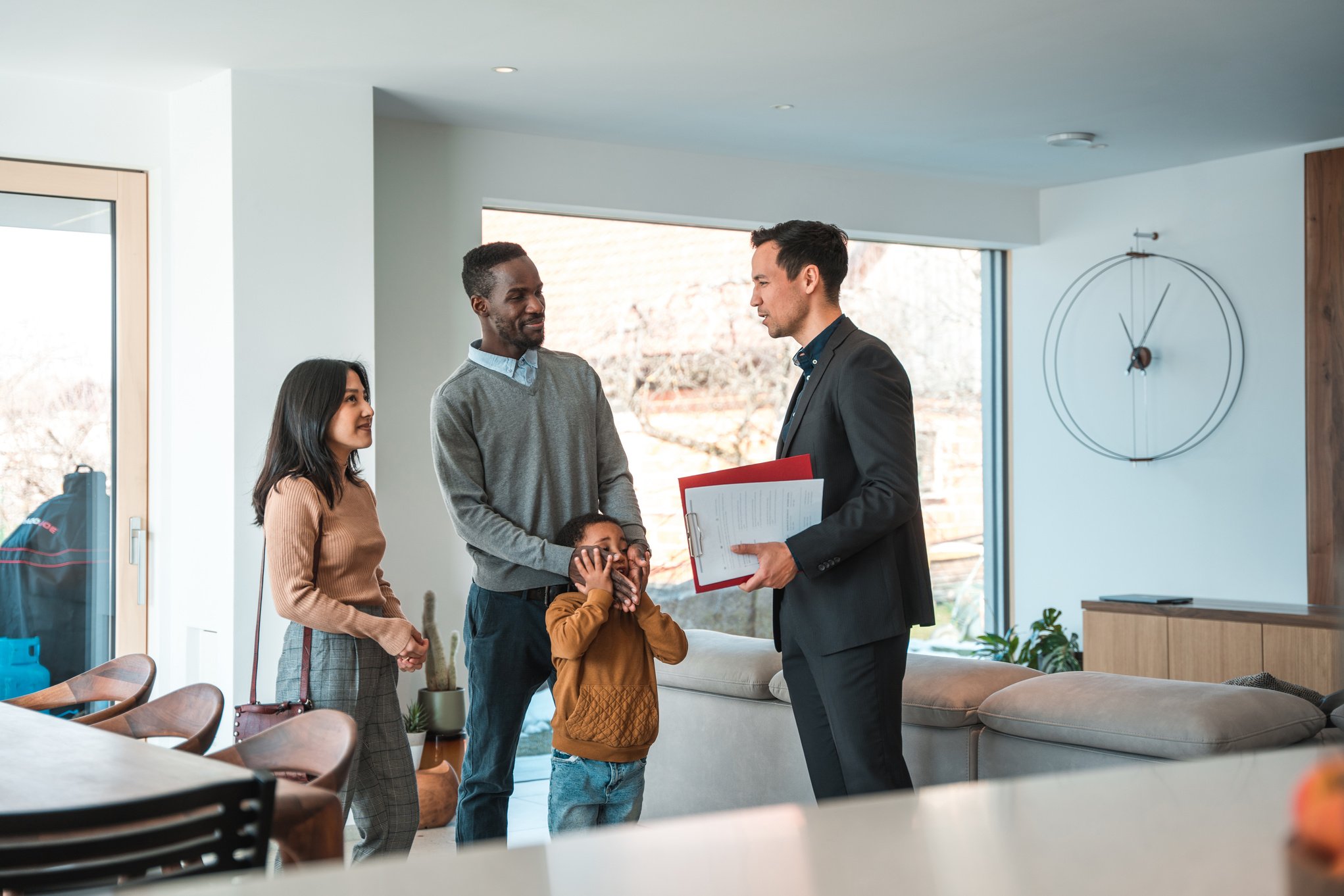 Diverse Family With One Child Buying A Home